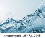 A stunning capture of clear blue water splashing, showcasing the beauty and vitality of moving water droplets. Perfect for advertisements and publications related to nature and purity.