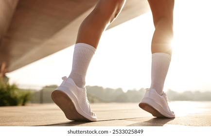 A stunning closeup view of fashionable legs along with colorful patterned lace socks, gracefully walking beneath a sunlit bridge in a calm and serene outdoor atmosphere - Powered by Shutterstock