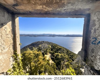 Stunning coastal view through a rustic stone window frame, overlooking lush greenery and a sparkling sea. Ideal for themes of adventure, exploration, and breathtaking landscapes. - Powered by Shutterstock