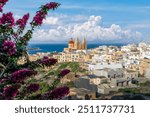 Stunning coastal views and Mediterranean charm, with beauty of Mellieha Parish Church in Malta. Perfect for travel and architectural photography.