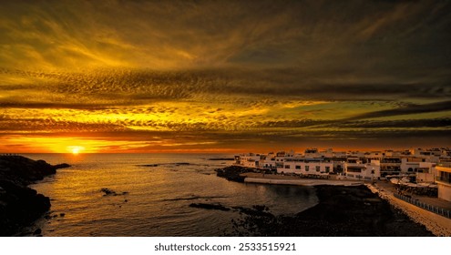 A stunning coastal village at sunset with dramatic skies and reflections on the water. - Powered by Shutterstock