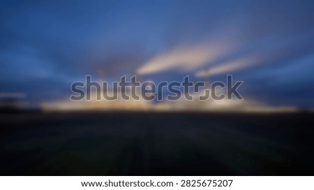 A stunning display of light rays emanating from behind clouds during twilight, creating a dramatic and awe-inspiring natural spectacle.