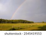 Stunning Double Rainbow Over Lush Field in Turner Valley, Diamond Valley, Alberta, Canada