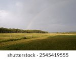 Stunning Double Rainbow Over Lush Field in Turner Valley, Diamond Valley, Alberta, Canada