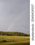 Stunning Double Rainbow Over Lush Field in Turner Valley, Diamond Valley, Alberta, Canada