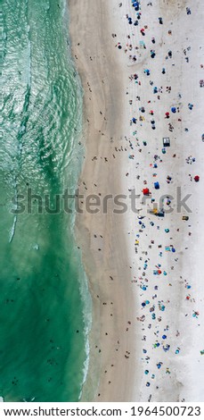 Similar – Luftaufnahme von fliegenden Drohnen der Menschenmenge, die sich am Strand in Rumänien am Schwarzen Meer entspannen.