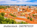 Stunning drone aerial image of old town of Zagreb, capital of Croatia, featuring upper town landmarks, colorful traditional architecture, and the beautiful skyline in the background