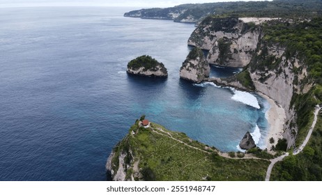 Stunning drone photograph capturing the pristine beauty of Diamond Beach, Nusa Penida, Bali. The image showcases the iconic white sand beach, turquoise waters, and dramatic limestone cliffs surrounded - Powered by Shutterstock