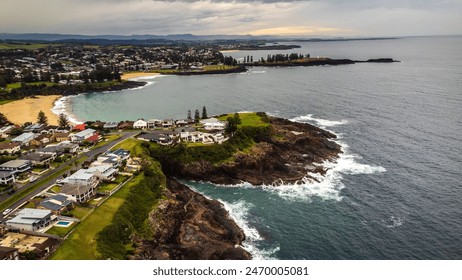 Stunning drone shot of Kiama from above, capturing the picturesque coastal town, vibrant ocean, and lush landscapes. Perfect for showcasing the scenic beauty and charm of this iconic Australian desti - Powered by Shutterstock