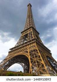 Stunning Eiffel Tower view with dark clouds. Closeup capture aiming to show different aspect of Eiffel tower in bad wheather.