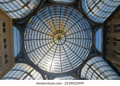 A stunning glass ceiling with intricate patterns, creating a beautiful play of light and shadow. The image evokes a sense of grandeur, elegance, and the beauty of architectural design. - Powered by Shutterstock