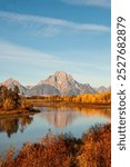 Stunning Grand Teton mountain range under a clear blue sky. This breathtaking landscape captures the rugged beauty of nature, perfect for projects related to outdoor adventures, travel, and scenic pho