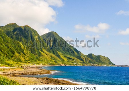 Stunning green mountain and blue ocean in Orchid Island, also known as Lanyu, a high island off the southeastern coast of Taiwan.