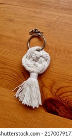 Stunning Handmade Off White Cotton Yarn Key Chain Lie On Wood