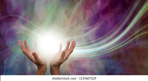 Stunning Healing Energy phenomenon  - female hands reaching up into a ball of white  energy with a laser trail and pink green ethereal energy field  background
 - Shutterstock ID 1119607229