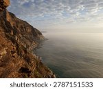 A stunning, high-angle panoramic perspective of the steep, rocky marine cliffs along the famous Chapman
