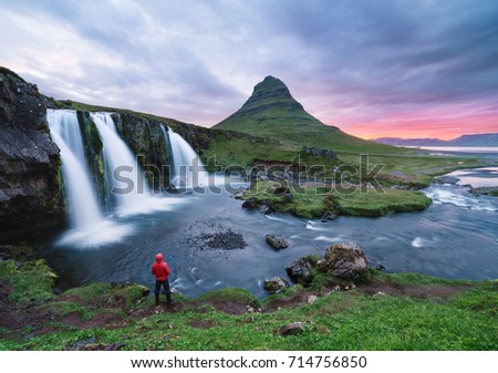 Stunning Icelandic landscape. Kirkjufellsfoss waterfall and Kirkjufell mountain. A famous tourist attraction near the city of Grundarfjordur