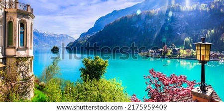 Stunning idylic nature scenery of lake Brienz with turquoise waters. Switzerland, Bern canton. Iseltwald village surrounded turquoise waters 