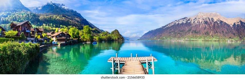 Stunning idylic nature scenery of mountain lake Brienz. Switzerland, Bern canton. Iseltwald village surrounded turquoise waters