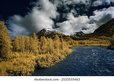 A stunning infrared landscape of a river flowing through a forest with snow-capped mountains in the background under a dramatic sky. - Powered by Shutterstock