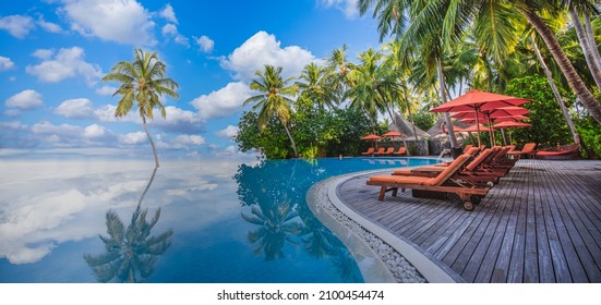 Stunning Landscape, Swimming Pool Blue Sky With Clouds. Tropical Resort Hotel In Maldives. Fantastic Relax And Peaceful Vibes, Chairs, Loungers Under Umbrella And Palm Leaves. Luxury Travel Vacation