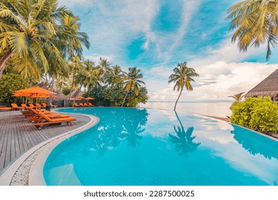 Stunning landscape, swimming pool blue sky with clouds. Tropical resort hotel in Maldives. Fantastic relax and peaceful vibes, chairs, loungers under umbrella and palm leaves. Luxury travel vacation - Shutterstock ID 2287500025