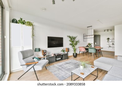 Stunning Living Area With Gray Plush Sofa And Glass Coffee Table