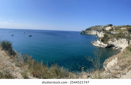 Stunning Mediterranean view with vibrant blue ocean, clear skies, and mountain peaks set against lush Italian nature. Ideal for travel, nature, and coastal-themed projects. - Powered by Shutterstock