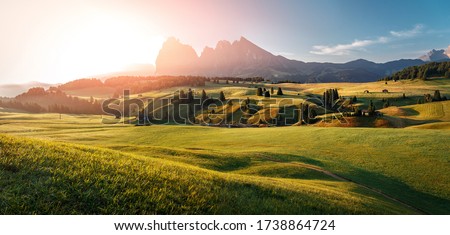 Stunning morning Scene. Majestic Moutain peak under sunlight, Alpe di Siusi valley during sunset. Amazing Nature Landscape. Awesome natural Background. Incredible colorful Scenery. Dolomites alps