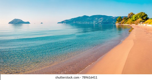 Stunning Morning View Of Beach Of Zakynthos (Zante) Island. Sunny Spring Seascape Of The Ionian Sea, Greece, Europe. Beauty Of Nature Concept Background.