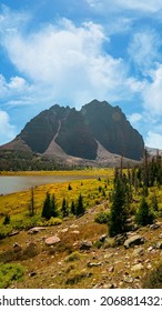 Stunning Nature Landscape View Of An Incredible Rocky Mountain Up A Backpacking Trail In The High Uinta National Forest Between Utah And Wyoming With A Fishing Lake Below And Pine Trees Surrounding.