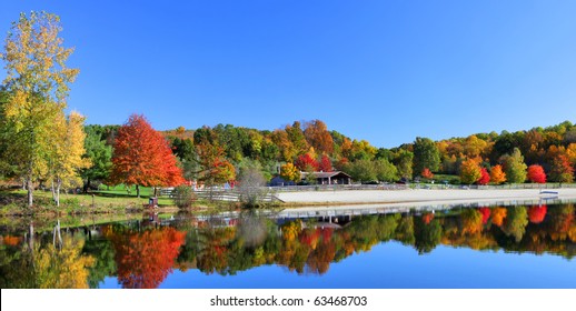 Stunning New England Lake In Fall With Blue Sky