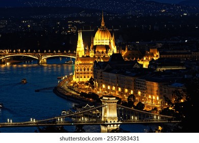 Stunning night view of Budapest featuring the illuminated Parliament building, Chain Bridge, and Danube River with reflections and boats. A vibrant cityscape highlighting Hungarian landmarks and archi - Powered by Shutterstock