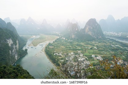 A stunning observation viewpoint of Laozhai mountain in Yangshuo, Guilin, China. Look down to Li river with the small heritage town beside.