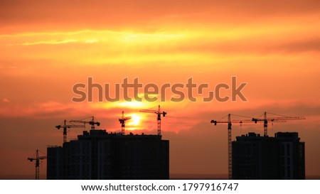 
Stunning orange sunset gently blurred across the sky over the city