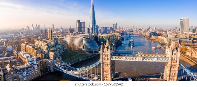 Stunning panorama view over Thames river, the Shard, the London skyline and cityscape from the skyscraper. Aerial photo over the big city. - Shutterstock ID 1579361542