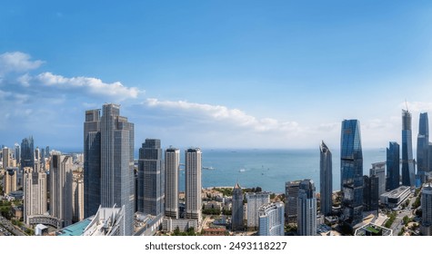 Stunning Panoramic View of a Coastal City Skyline Under Clear Blue Sky - Powered by Shutterstock