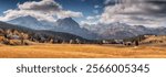 Stunning panoramic view of Durmitor national park with colorful foliage and mountains under cloudy sky in Montenegro