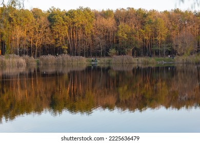 Stunning Photo Of Fall Foliage Reflected On A Lake With A Glass Like Mirror Water Surface