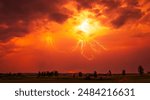 A stunning red sky lightning storm. Climate change concept