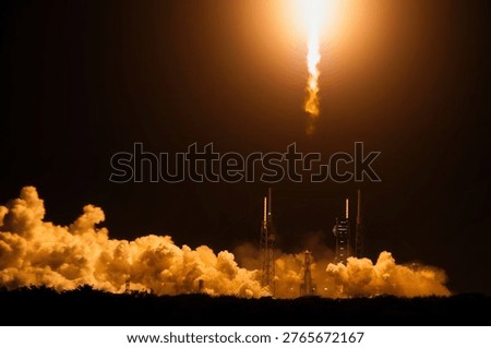 Stunning rocket launch under a starry sky with dramatic smoke and flame effects. Rocket liftoff. Vertical launch of a shuttle. Rocket in space. Elements of this image furnished by NASA