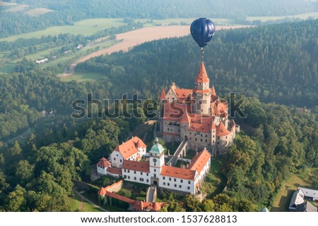 Stunning shot of hot air ballon right above castle Bouzov, perfect for wallpaper