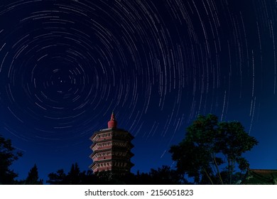 A stunning shot of the Wenfeng tower (Anyang Tianning Temple Tower) with star trails at night sky - Powered by Shutterstock