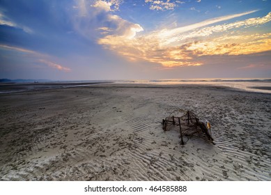 Stunning Sunrise With Running Clouds And Broken Fish Net. Copyspace Is Available.