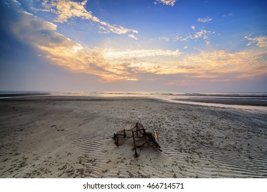 Stunning Sunrise With Running Clouds And Broken Fish Net. Copyspace Is Available.