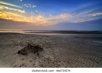 Stunning Sunrise With Running Clouds And Broken Fish Net. Copyspace Is Available.