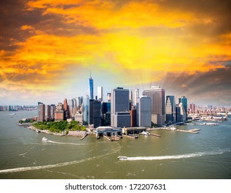 Stunning sunset over lower Manhattan. Aerial view of New York, Hudson and East River.