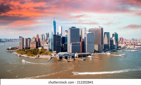 Stunning sunset over lower Manhattan. Aerial view of New York, Hudson and East River.