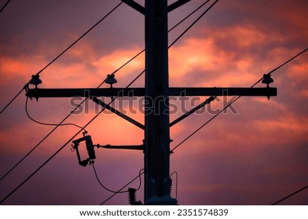 Stunning Sunset Photo with Telephone Pole in Foreground, orange sky