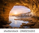 Stunning sunset view of Ayia Napa sea caves in Cyprus, showcasing a serene Mediterranean landscape.